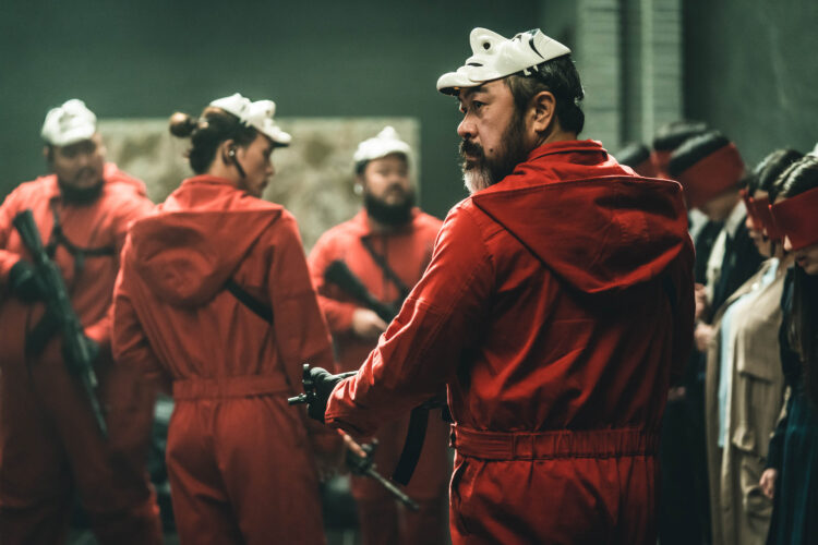 Money Heist Korea: JEA (L to R) Lee Kyu-ho as Oslo, Kim Ji-hun as Denver, Kim Ji-hoon as Helsinki and Lee Won-jong as Moscow in episode # 1 of Money Heist Korea: JEA. Cr. Jung Jaegu/Netflix © 2021